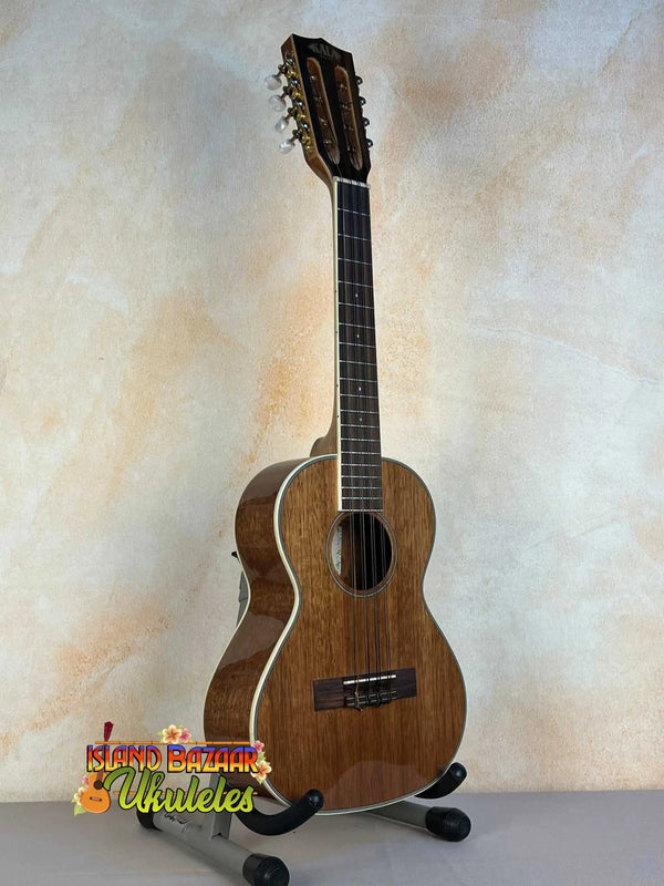 Wooden ukulele on stand, showcasing Kala KA-8 Eight-String Tenor in gloss mahogany finish