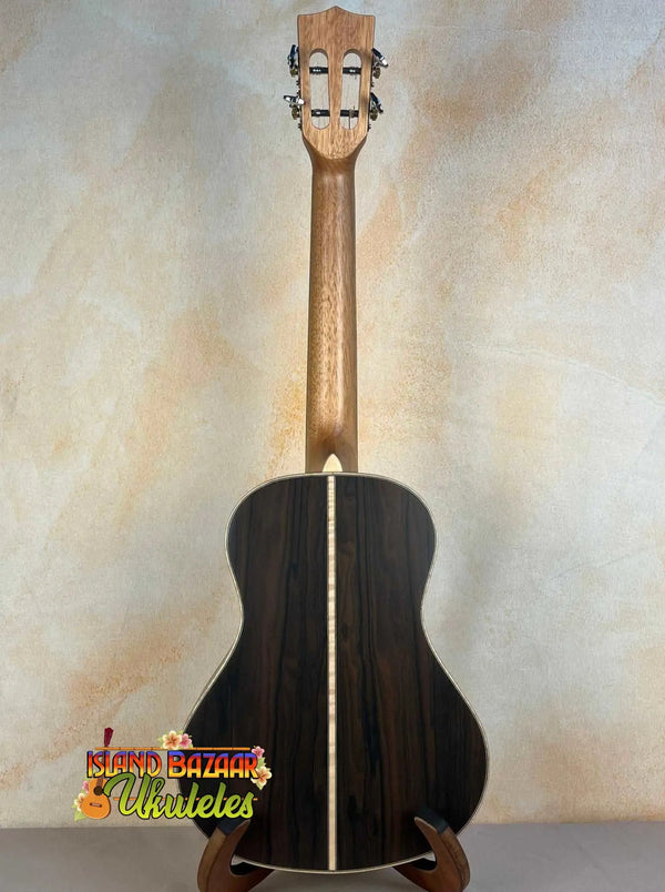 Black acoustic guitar with wooden neck, featured in Kala KA-ASZCT-ST Super Tenor Ukulele