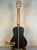 Black acoustic guitar with wooden neck, featured in Kala KA-ASZCT-ST Super Tenor Ukulele