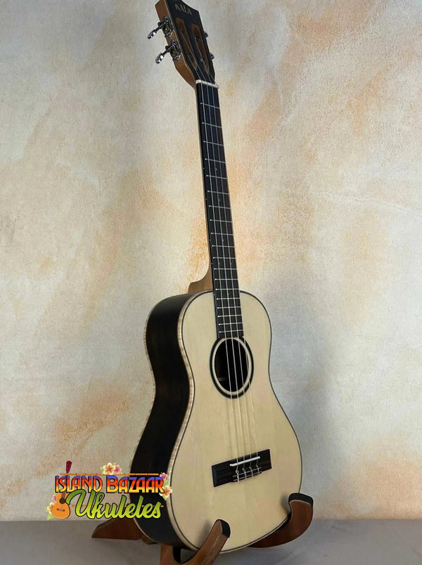 Natural wood Kala KA-ASZCT-ST Super Tenor Ukulele with black trim and four strings