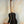 Black Kala KA-ASZCT-ST Super Tenor Ukulele with white trim on wooden stand