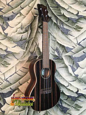 Dark wooden Kala KA-EBY-C Striped Ebony Concert Ukulele with four strings and sound hole