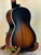 Acoustic guitar with sunburst finish, featured in Kala KA-JTE-2TS Archtop Tenor Ukulele