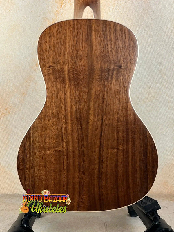 Acoustic guitar with rich brown back, part of Kala KA-SA-C Acacia Concert Ukulele