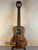 Wooden Kala KA-SA-T Acacia Tenor Ukulele featuring dark grain and four strings