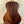 Wooden acoustic guitar on black stand featuring Kala KA-SA-T Acacia Tenor Ukulele design