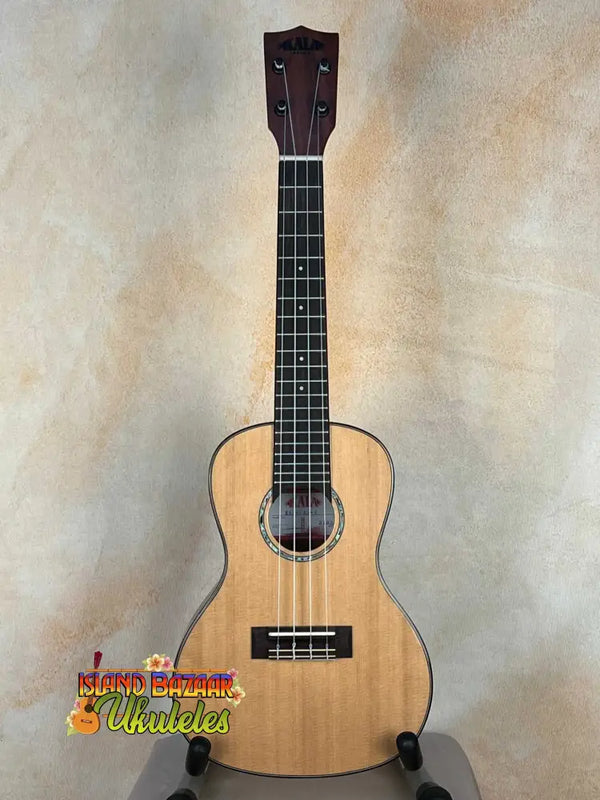 Natural wood Kala KA-SCAC-C Concert Ukulele with solid cedar top and dark fretboard