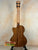 Wooden Kala KA-SCAC-T-CE Tenor Ukulele with natural finish on black stand