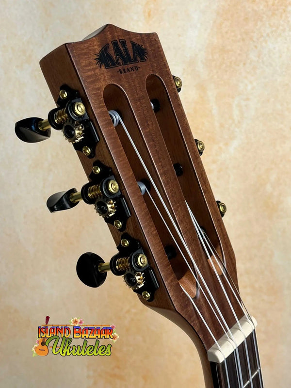 Wooden guitar headstock and black tuning pegs on Kala KA-SCAC-T6 Cedar Tenor Ukulele