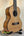 Wooden Kala KA-SCAC-T6 6-String Tenor Ukulele with Cedar Top on a black stand