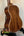 Acoustic guitar with rich brown body, complementing Kala KA-SMH-TG Solid Mahogany Tenor Ukulele