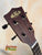 Kala KA-SMHT Tenor Ukulele headstock with dark wood finish and black tuning pegs