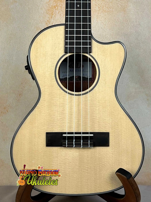 Natural wood Kala KA-STGE-C tenor ukulele with mahogany cutaway and built-in EQ electronics