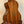 Wooden acoustic guitar with rich brown finish, complementing Kala KA-STGE-C Tenor Ukulele