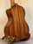 Wooden acoustic guitar with rich brown finish, complementing Kala KA-STGE-C Tenor Ukulele