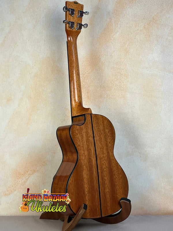 Wooden acoustic guitar showcasing grain patterns in Kala KA-STGE-C Tenor Ukulele Spruce Mahogany Cutaway