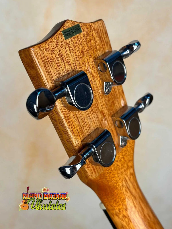 Wooden guitar headstock with black tuning pegs on Kala KA-STGE-C Tenor Ukulele