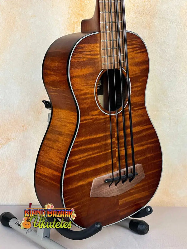 Beautiful brown acoustic bass ukulele with striped wood grain, Kala Left-Handed U-Bass