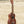 Brown wooden Kala Makala-Series Satin Mahogany Soprano Ukulele Model MK-S on sand