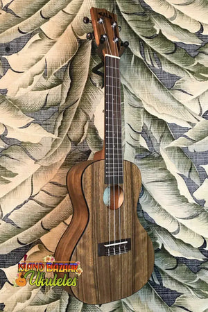 Wooden ukulele with dark brown finish from Kala Pacific’s premier exotic series