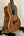 Kala SA-C Concert Ukulele with Spruce & Acacia on a black stand, elegant design
