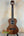 Wooden Kala SA-T Tenor Ukulele with dark brown finish and black strings at Island Bazaar Ukes