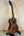 Wooden baritone ukulele on stand, highlighting Kala SA-T Tenor Ukulele’s design and tone