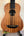Wooden Kala U-Bass Nomad Acoustic-Electric Bass Ukulele with black fretboard and bridge