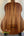 Wooden Kala U-Bass Nomad Acoustic-Electric Bass Ukulele with dark grain pattern