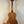 Wooden Kala U-BASS® Ukulele with Koa body and black tuning pegs for exotic sound