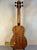 Wooden Kala U-BASS® Ukulele with Koa body and black tuning pegs for exotic sound