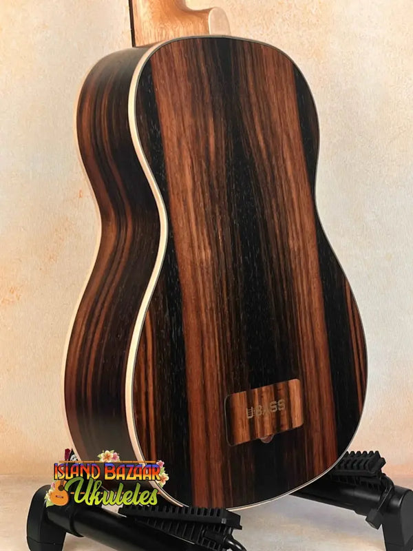 Acoustic guitar with dark rosewood, light binding, and Kala UBASS-EBY-FSRW Striped Ebony design