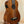 Wooden Kala Wanderer U-BASS Ukulele Acoustic-Electric with four strings on a stand