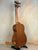 Wooden Kala Wanderer U-Bass Ukulele Acoustic-Electric with black tuning pegs on stand