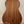 Wooden acoustic guitar on a black stand with Kala Wanderer U-Bass Ukulele nearby