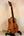 Wooden Kamaka Concert Ukulele HF-2 in solid Hawaiian Koa on a stand with dark fretboard