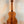 Wooden Kamaka Concert Ukulele HF-2 in solid Hawaiian Koa finish on black stand