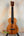 Wooden Kamaka Concert Ukulele HF-2 with natural Koa finish and black fretboard