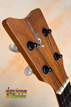 Wooden ukulele headstock with tuning pegs on Kamaka Concert Ukulele HF-2 in solid Hawaiian Koa