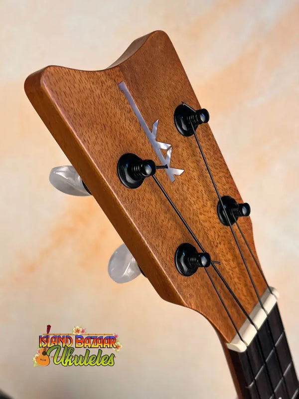 Wooden ukulele headstock with tuning pegs on Kamaka Concert Ukulele HF-2 in solid Hawaiian Koa