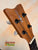 Wooden ukulele headstock with tuning pegs on Kamaka Concert Ukulele HF-2 in solid Hawaiian Koa