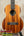 Brown wooden tenor ukulele showcasing the Kamaka HF-3 design and Hawaiian koa tone