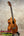 Brown wooden Kamaka HF-3 tenor ukulele showcased in the Hawaiian Koa Tone Machine product