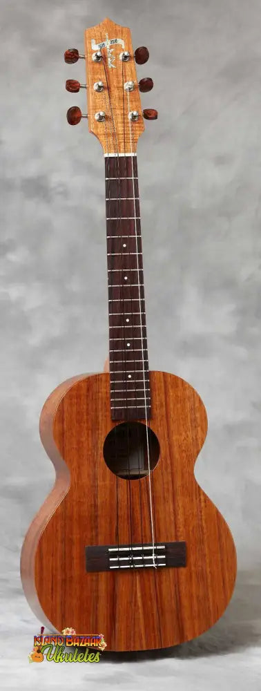 Wooden Kamaka HF-36 Tenor 6-String Ukulele with natural finish and dark fretboard