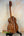 Wooden Kamaka HF3-D2i Tenor Uke Deluxe with unique grain on black stand in hard case