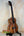 Wooden Kamaka HF3-D2i Tenor Uke with unique grain, displayed on black stand