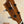 Wooden headstock of Kamaka HP-1 Pineapple Soprano Ukulele with tiger stripe pattern