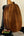 Wooden back panel of Kamaka HP-1 Pineapple Soprano Ukulele with rich brown grain