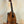 Wooden Kamaka HP-1 Pineapple Soprano Ukulele in solid Hawaiian Koa on black stand