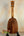 Wooden Kamaka HP-1 Pineapple Soprano Ukulele with natural finish and black stand